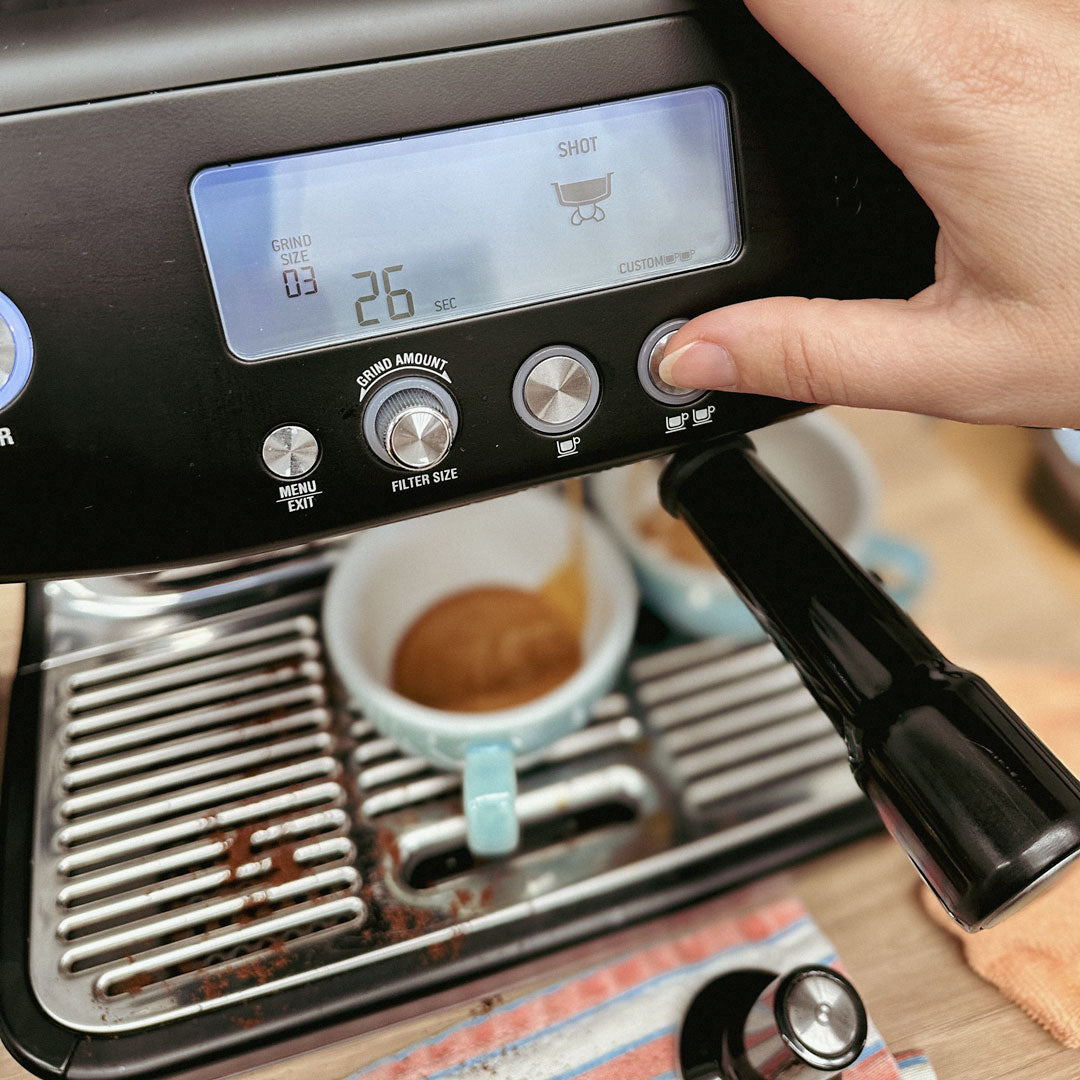 Home barista learning on their own coffee machine during a 1:1 barista class at 23 Degrees Coffee Roasters in Cheltenham, Melbourne.