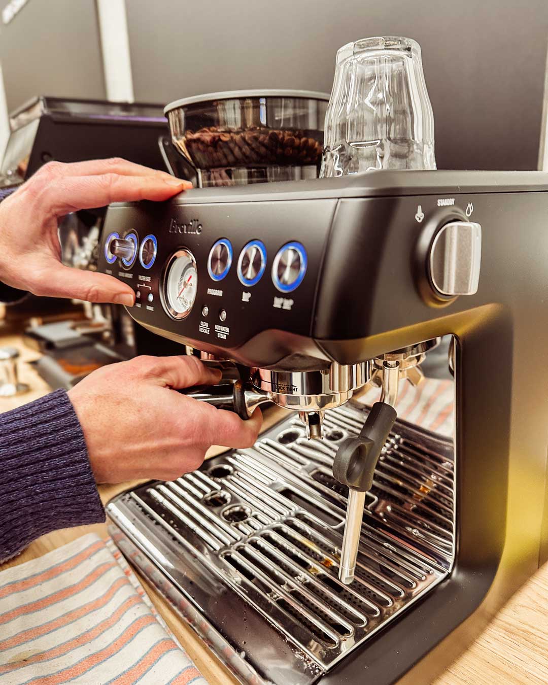 student operating his Breville Barista Express Impress in 23 Degrees BYO Cofefe Machine Home Barista lass
