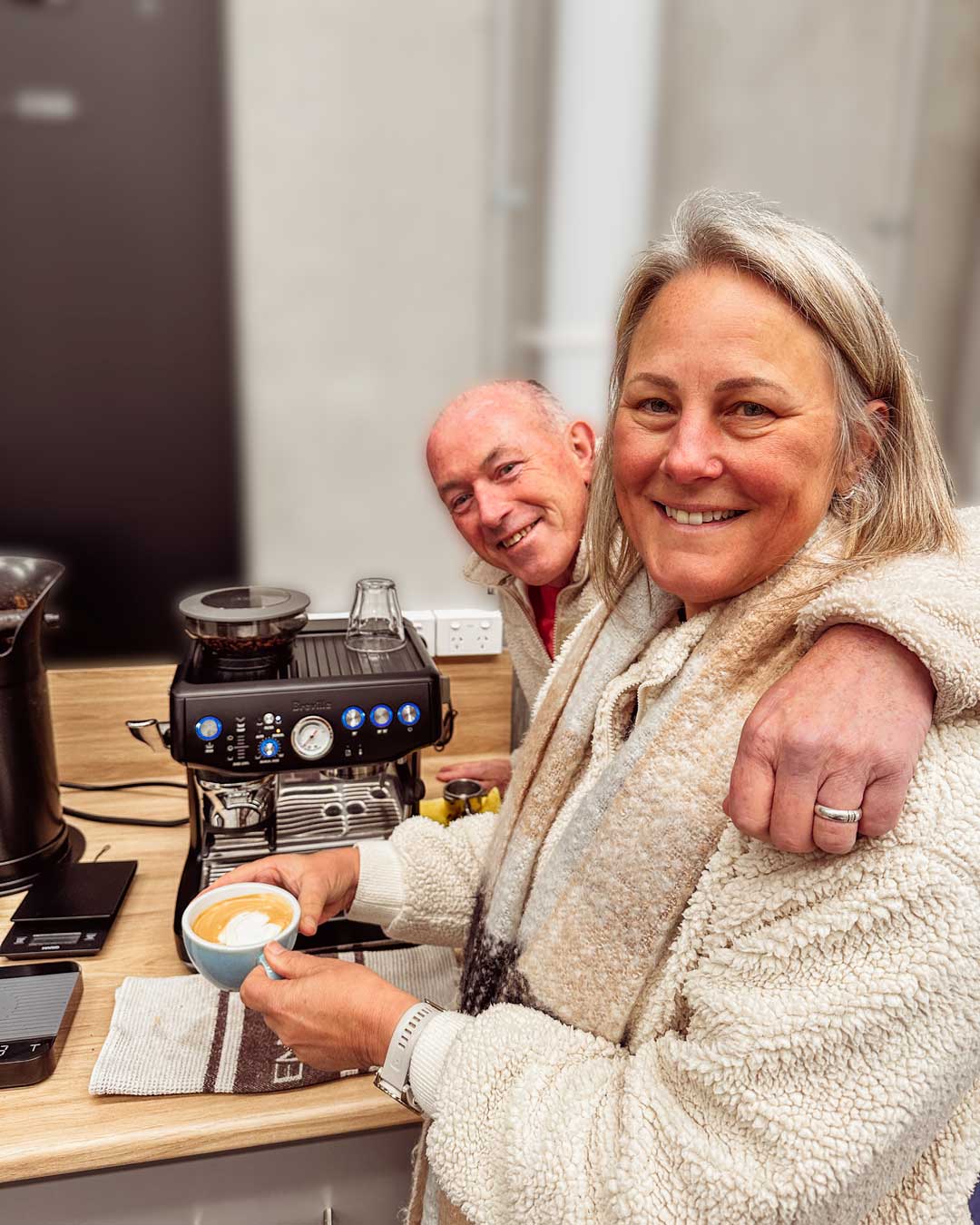 smiling students with their Breville Barista Express Impress coffee machine in home barista class