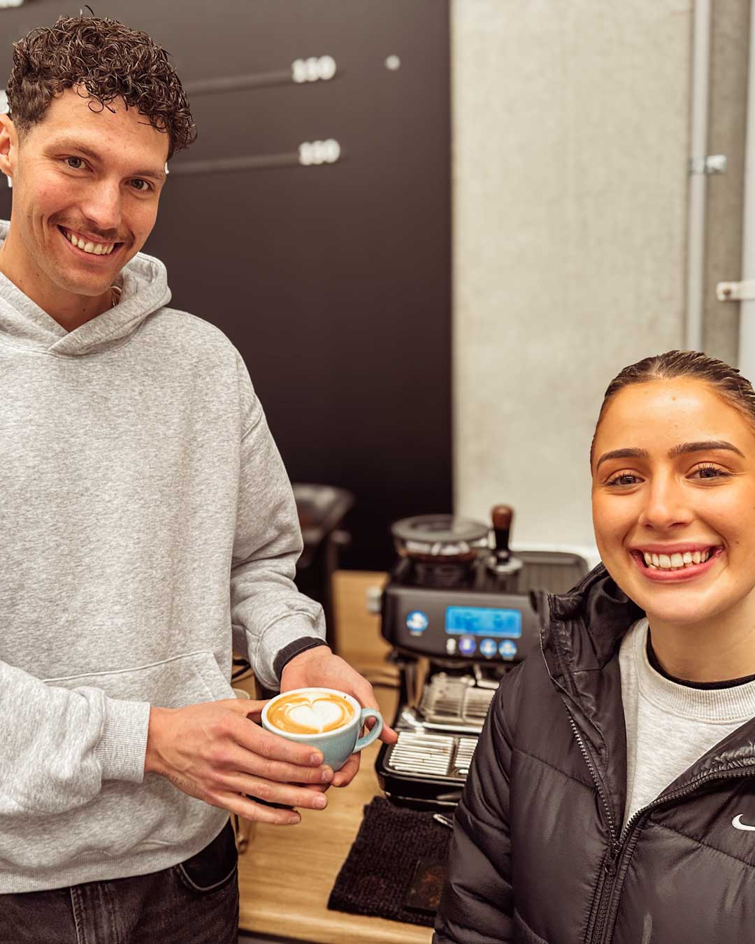 smiling students with their Breville Barista Pro coffee machine in home barista class